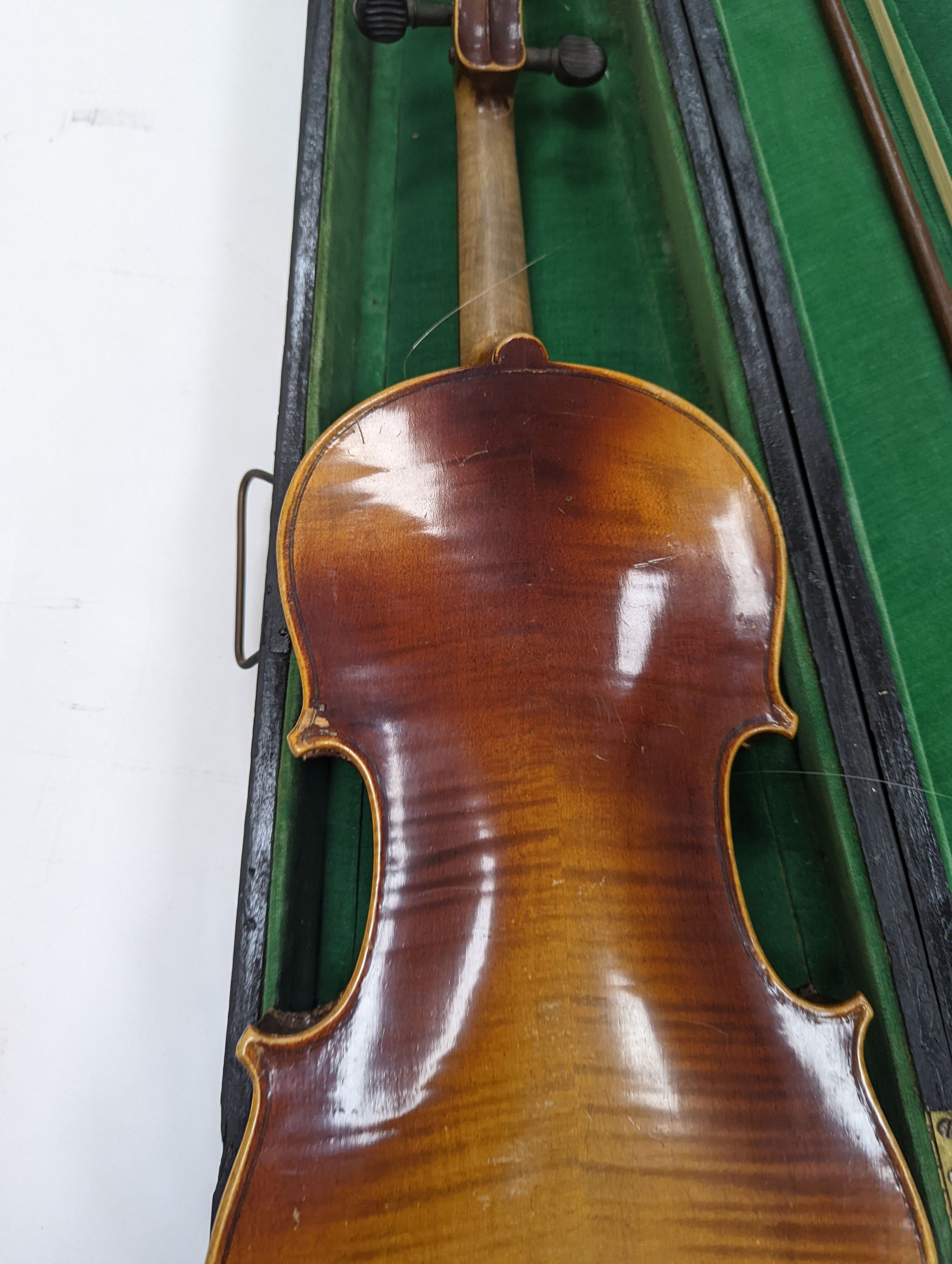 Two cased violins and bows, one with ‘Antonius Straduarius Cremonensis Faciebat Anno 17/13 Made In Czechoslovakia’ label to interior